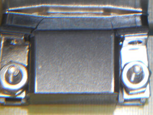 a DE-15 connector mounted to a circuit board with cracks through the plastic housing
